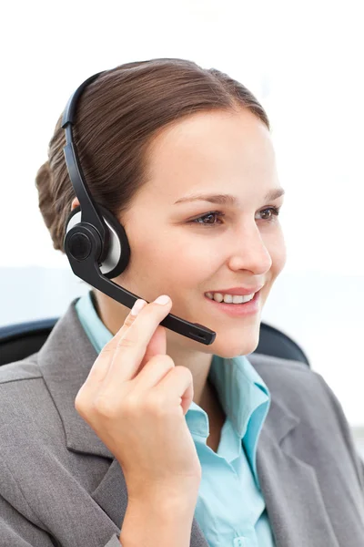 Pretty representative on the phone with earpiece — Stock Photo, Image
