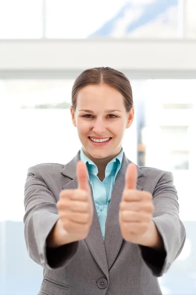 Proud businesswoman doing thumbs up — Stock Photo, Image