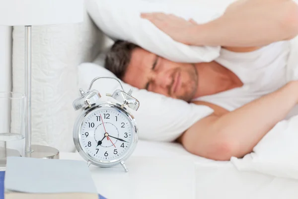 A irritate man in his bed before waking up — Stock Photo, Image