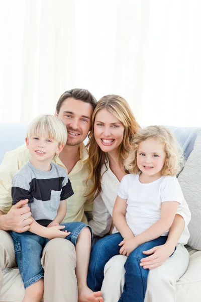 Cute family in their sofa — Stock Photo, Image