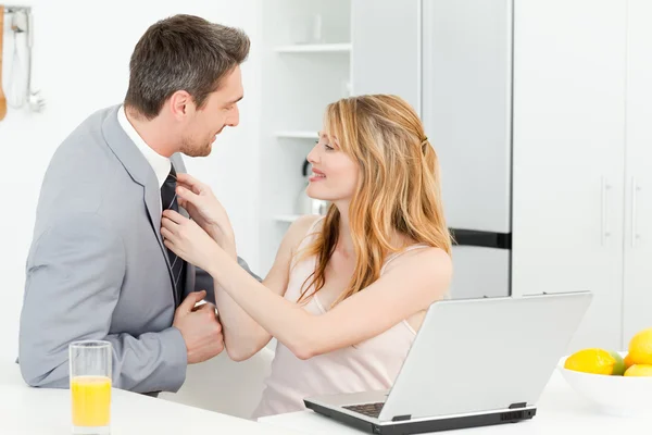 Woman adjusting the tie of her husband — Stock Photo, Image