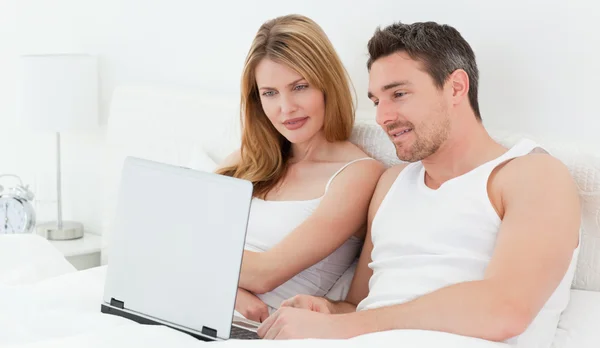Lovers watching a movie on their laptop — Stock Photo, Image