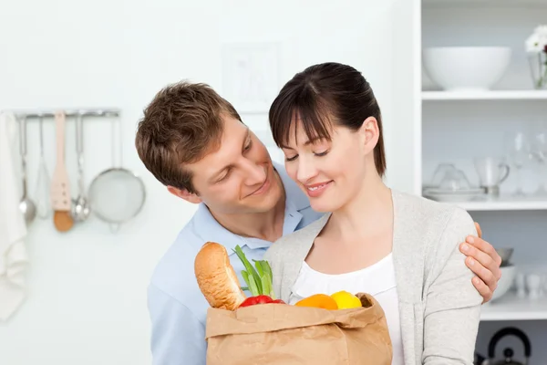 Adorable pairs looking at the shoping bags — Stock Photo, Image
