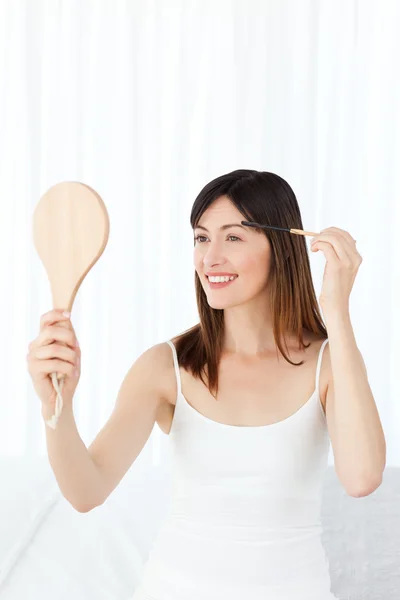Beautiful woman putting on Make up — Stock Photo, Image