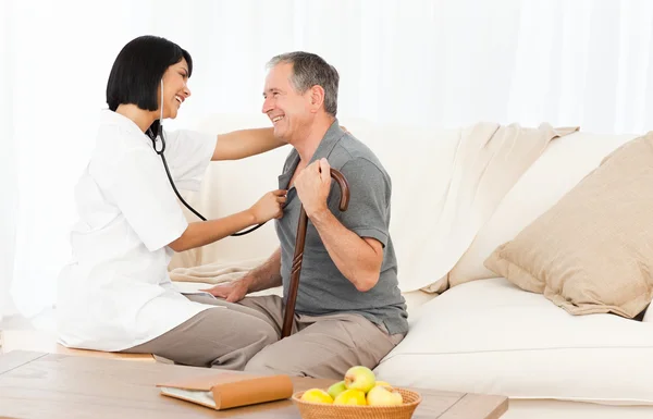 Retired man with his nurse — Stock Photo, Image