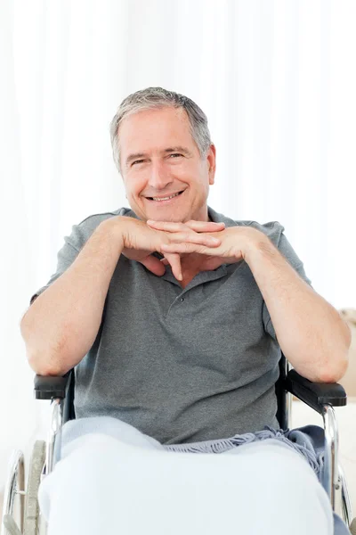 Man on his wheelchair looking at the camera — Stock Photo, Image