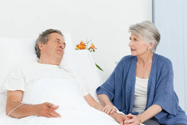 Mature woman taking care of her husband — Stock Photo, Image