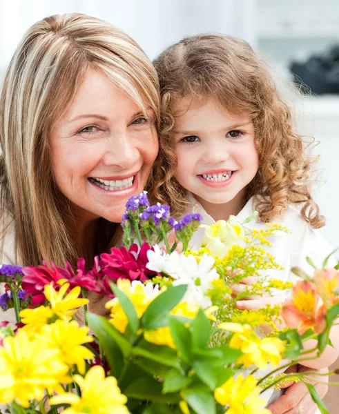Young girl with her grandmother looking at the camera — Stock Photo, Image