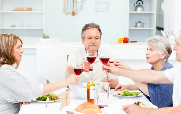 Retired friends toasting together — Stock Photo, Image