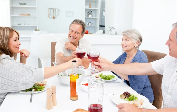Retired friends toasting together — Stock Photo, Image