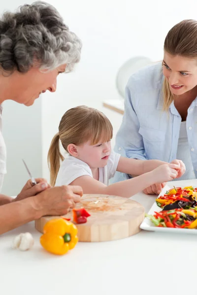 Family cooking together in the kitchen at home — Stock Photo, Image