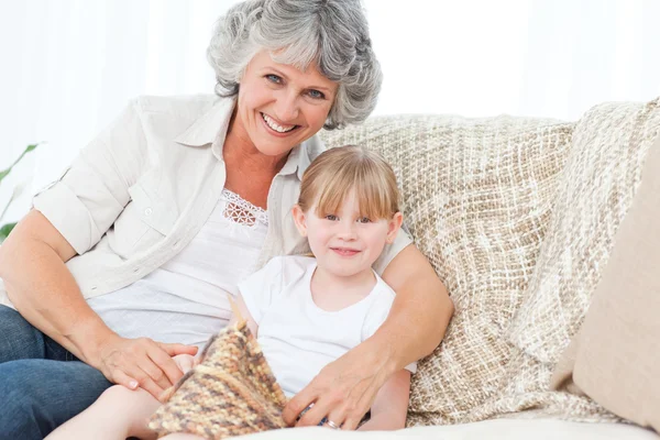 Grandmother helping her little girl to knit — Stock Photo, Image