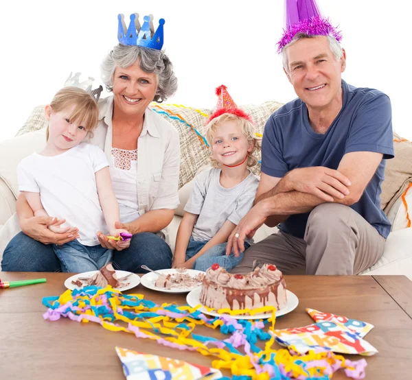 Happy family looking at the camera on a birthday — Stock Photo, Image