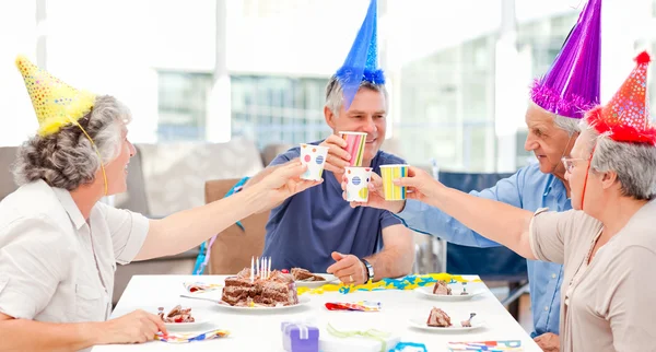 Mature friends on birthday — Stock Photo, Image