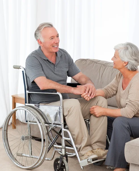 Woman with her husband in a wheelchair — Stock Photo, Image