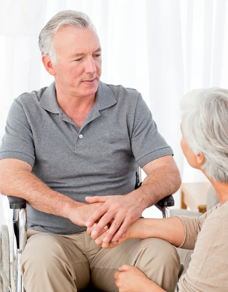 Woman with her husband in a wheelchair — Stock Photo, Image