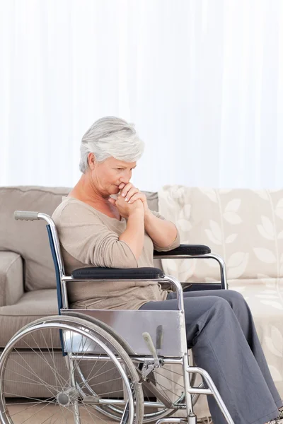 Thoughtful senior in her wheelchair — Stock Photo, Image