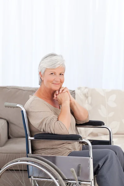 Woman looking at the camera in her wheelchair — Stock Photo, Image