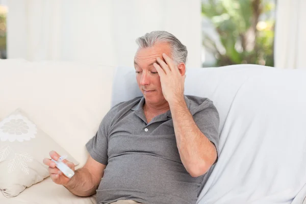 Senior with pills at home — Stock Photo, Image