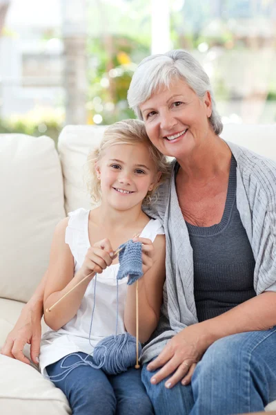 Senior with her granddaughter looking at the camera — Stock Photo, Image