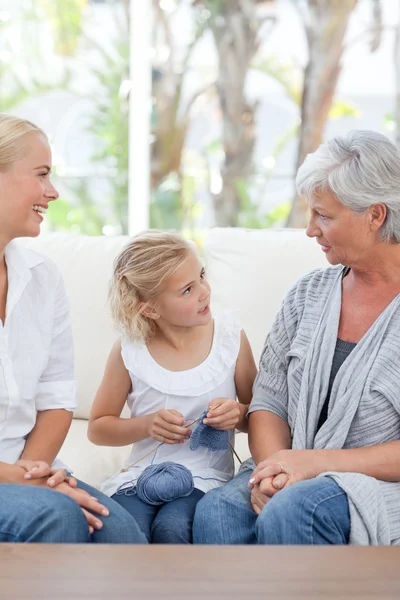Family knitting together at home — Stock Photo, Image