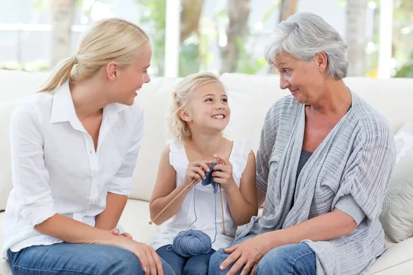 Family knitting together at home — Stock Photo, Image