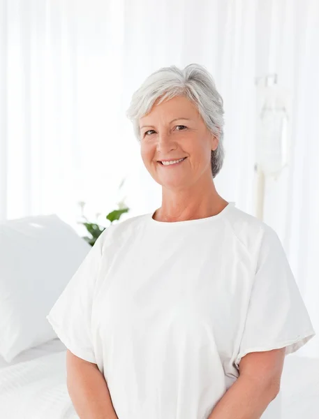 Happy woman looking at the camera in a hospital — Stock Photo, Image