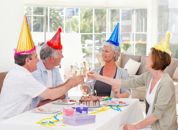 Seniors on birthday at home — Stock Photo, Image