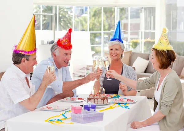 Seniors on birthday at home — Stock Photo, Image