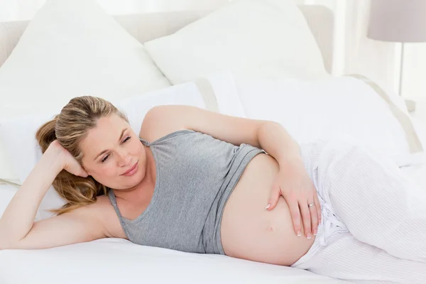 Beautiful woman with her hands on her belly — Stock Photo, Image