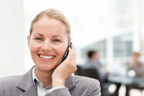 Lovely woman phoning in her office — Stock Photo, Image