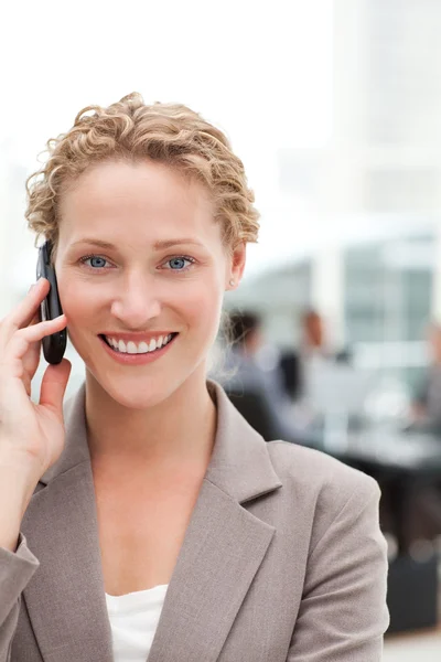 Beautiful businesswoman phoning in her office — Stock Photo, Image