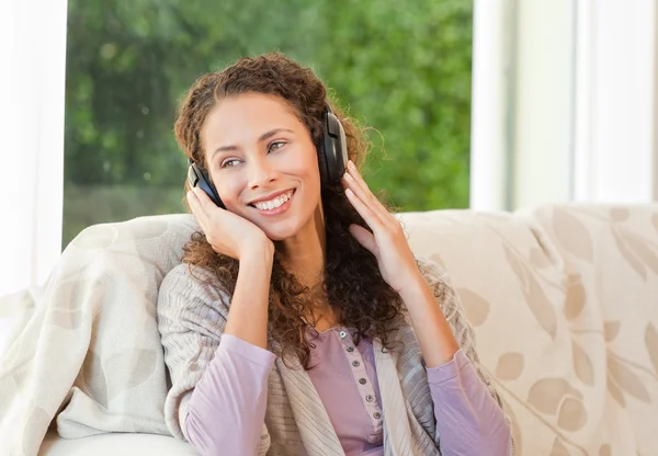 Radiant woman listening to music — Stock Photo, Image