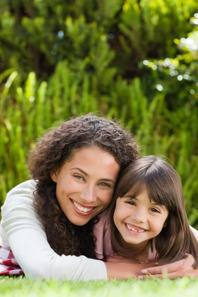 Adorable mother with her daughter in the garden — Stock Photo, Image