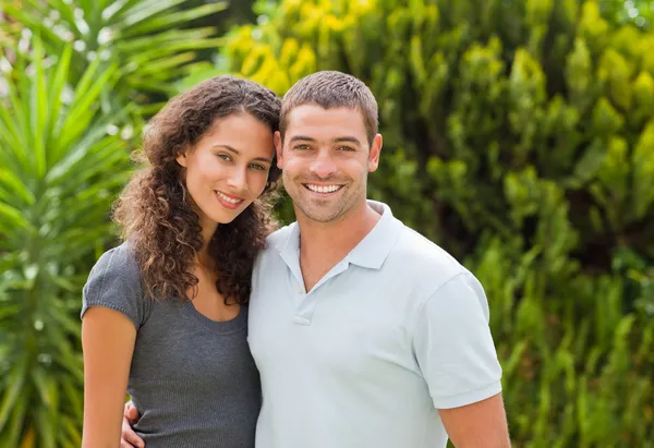 Happy couple hugging in the garden — Stock Photo, Image