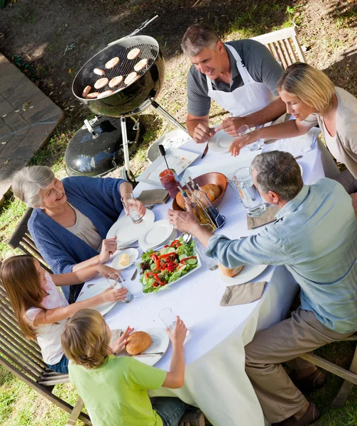 Family eating in the garden — Stock Photo, Image