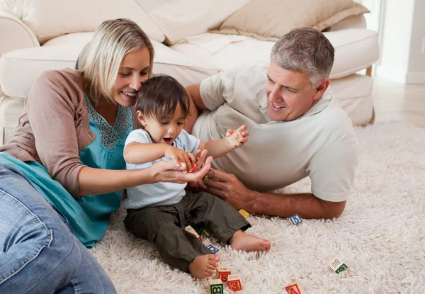 Son playing with his parents — Stock Photo, Image