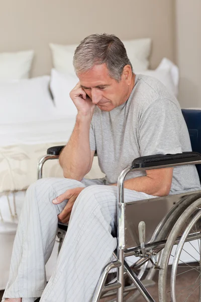Thoughtful senior man in his wheelchair — Stock Photo, Image