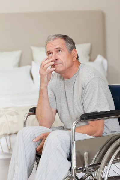 Thoughtful senior man in his wheelchair — Stock Photo, Image