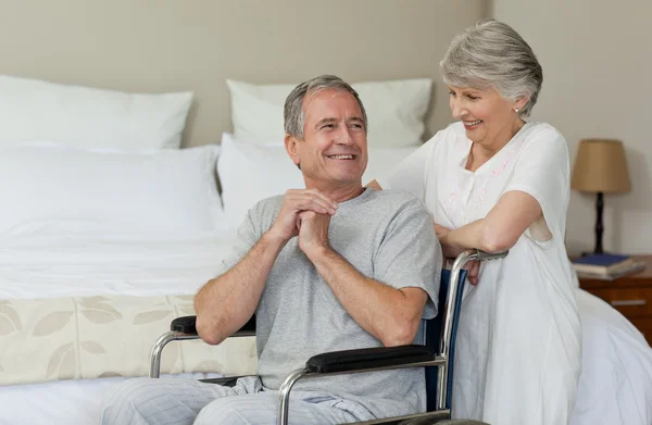 Mature couple in their bedroom — Stock Photo, Image