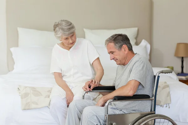 Mature couple in their bedroom — Stock Photo, Image