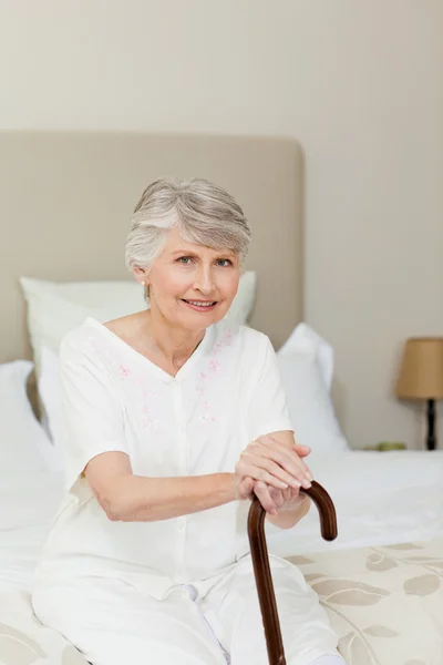 Retired woman with her walking stick — Stock Photo, Image