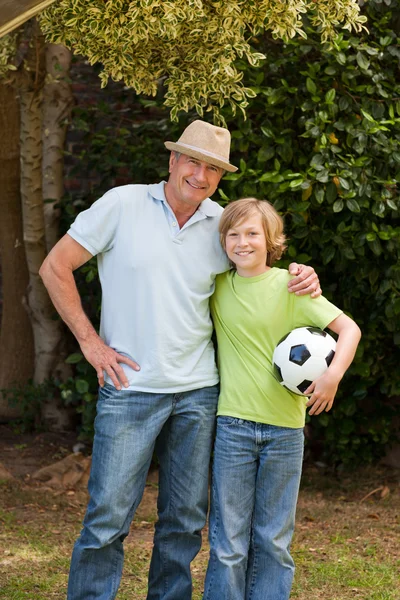 Grandfather and his grandson looking at the camera — Stock Photo, Image