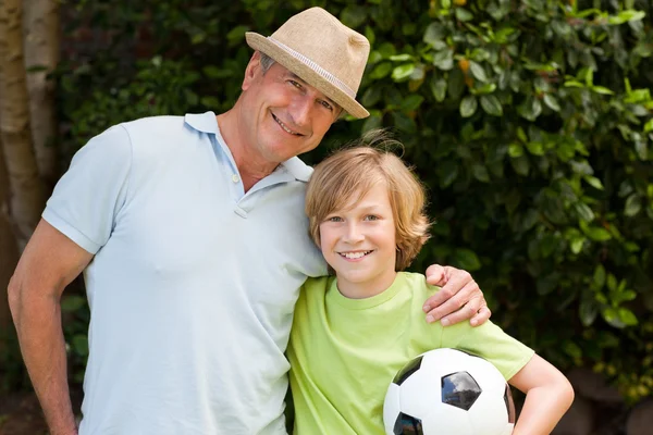 Grandfather and his grandson looking at the camera — Stock Photo, Image