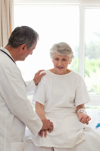 Mature doctor with his patient — Stock Photo, Image