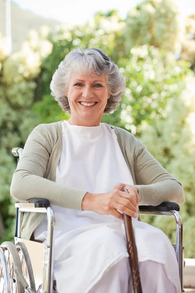 Retired woman with her walking stick — Stock Photo, Image