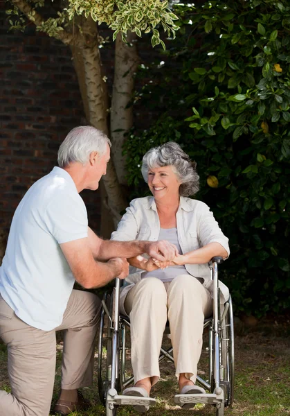 Mature couple in the garden — Stock Photo, Image