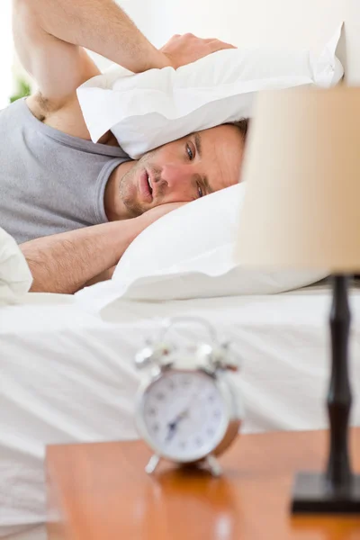 Man waking up in his bed — Stock Photo, Image