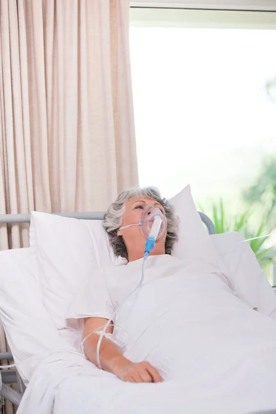 Senior woman with her respirator — Stock Photo, Image