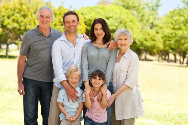 Family standing in the park — Stock Photo, Image